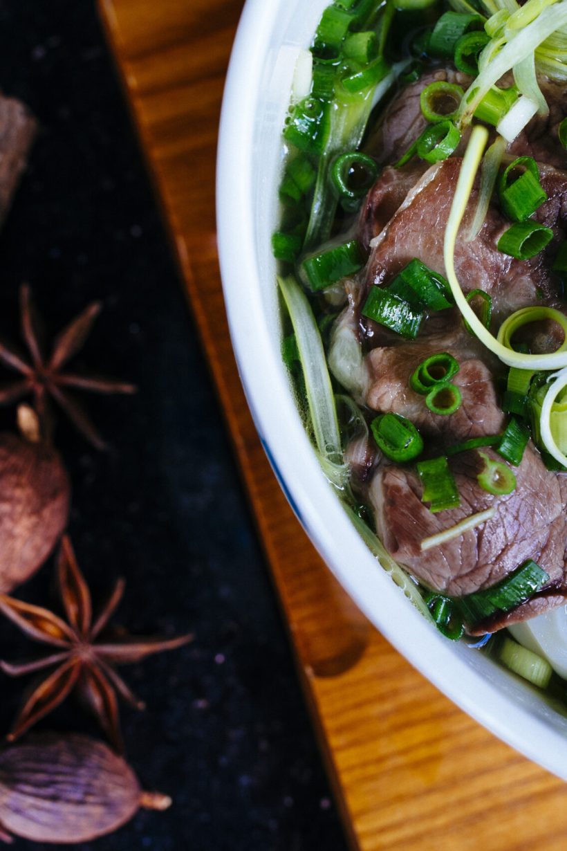 High angle close up of a bowl of beef pho.
